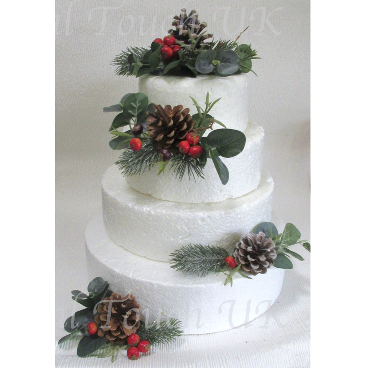 Pine Cone, Berry & Foliage Cake Flowers 

with sparkle pine, eucalyptus and foliage